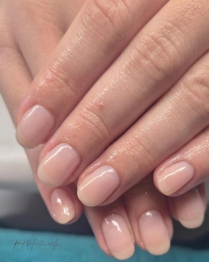 A natural, glossy BIAB overlay on short nails