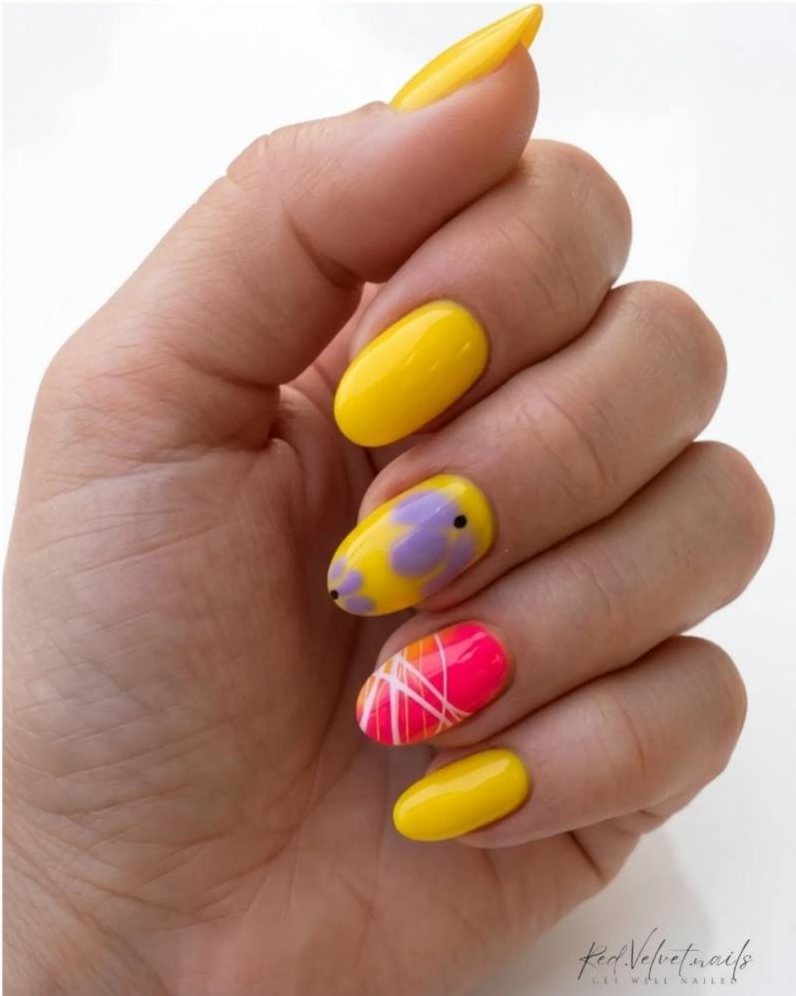 Yellow almond nails with lilac flowers and pink abstract lines